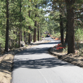 A truck parked on the Legacy Trail as it is repaved. 