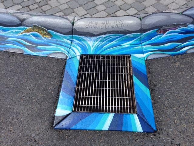 Sewer Grate Surrounded by Mural